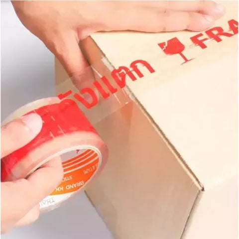 เทปพิมพ์ลาย ระวังแตก Fragile Tape 2 นิ้ว x 50 หลา (พื้นใส ตัวอักษรสีแดง)